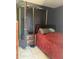 Bedroom showcasing a cozy bed, nightstand, glass door, and dark curtain at 608 W 2Nd Pl, Mesa, AZ 85201