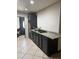 Kitchen showcasing dark cabinets, granite countertops, and tile flooring; ready for your personal touches at 608 W 2Nd Pl, Mesa, AZ 85201