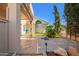 Well-manicured backyard with lush lawn, mature trees, and a wooden patio area at 6510 S Hazelton Ln # 101, Tempe, AZ 85283