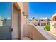 A sunny balcony offers neighborhood views from behind a glass sliding door at 6510 S Hazelton Ln # 101, Tempe, AZ 85283