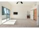 Carpeted bedroom featuring access to balcony and en suite bathroom at 6510 S Hazelton Ln # 101, Tempe, AZ 85283