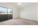 Bedroom features carpeting, ceiling fan, sliding door and neighborhood views at 6510 S Hazelton Ln # 101, Tempe, AZ 85283
