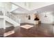 Large living space with hardwood floors, staircase, and open layout perfect for modern living at 6510 S Hazelton Ln # 101, Tempe, AZ 85283