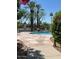 Inviting community pool area with decorative concrete and beautiful landscaping at 6510 S Hazelton Ln # 101, Tempe, AZ 85283