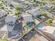 Aerial view of the home featuring a pool, pergola, artificial turf, and a desert landscaped yard at 6623 S 23Rd Dr, Phoenix, AZ 85041