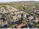 Expansive aerial view showing the neighborhood, nearby mountains, and lush green landscaping, enhancing the community's appeal at 6623 S 23Rd Dr, Phoenix, AZ 85041