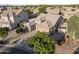 Attractive aerial view of a single-Gathering home with a tile roof, desert landscaping, and a two-car garage at 6623 S 23Rd Dr, Phoenix, AZ 85041