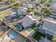 A beautiful aerial view featuring a pool, putting green, and well-maintained landscaping in a suburban setting at 6623 S 23Rd Dr, Phoenix, AZ 85041