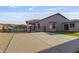 This backyard features a concrete patio, artificial grass, and a wrought iron fence at 6623 S 23Rd Dr, Phoenix, AZ 85041