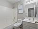 This bathroom features a shower-tub combination and a vanity with a sink and a mirror at 6623 S 23Rd Dr, Phoenix, AZ 85041