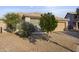 Charming single-story home with desert landscaping, a private driveway, and a two-car garage, nestled in a quiet neighborhood at 6623 S 23Rd Dr, Phoenix, AZ 85041