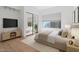 A serene bedroom features a closet with mirror, a neutral color palette, and ample natural light for relaxation at 6935 W Monte Lindo St, Glendale, AZ 85310