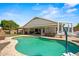 Beautiful backyard pool surrounded by a patio, with a basketball hoop for added fun at 6935 W Monte Lindo St, Glendale, AZ 85310