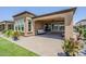 Exterior of home featuring a covered patio and landscaped backyard at 699 E Watermelon Ln, Queen Creek, AZ 85140