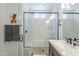 Bathroom featuring a shower, vanity, and large mirror at 699 E Watermelon Ln, Queen Creek, AZ 85140