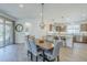 Open dining room area adjacent to the kitchen, features a stylish light fixture at 699 E Watermelon Ln, Queen Creek, AZ 85140
