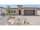 Attractive single-Gathering home with desert landscaping, a two car garage, and a covered front entrance at 699 E Watermelon Ln, Queen Creek, AZ 85140