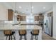 Well-equipped kitchen boasts stainless steel appliances and a breakfast bar area at 699 E Watermelon Ln, Queen Creek, AZ 85140