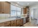 Spacious kitchen with stainless steel appliances, tile backsplash, and modern cabinets at 699 E Watermelon Ln, Queen Creek, AZ 85140