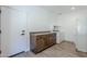 Mud room features cabinets, washer and dryer and exterior access at 699 E Watermelon Ln, Queen Creek, AZ 85140