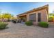 Desert landscaping accents this backyard with patio, fire pit, and covered space at 7152 E Night Glow Cir, Scottsdale, AZ 85266