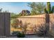 Desert landscaped backyard featuring desert plants and a rock formation at 7152 E Night Glow Cir, Scottsdale, AZ 85266