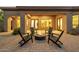 Relaxing backyard area featuring a fire pit and brick patio at 7152 E Night Glow Cir, Scottsdale, AZ 85266