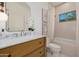 Cozy bathroom featuring a wood vanity, marble countertops, a shower/tub combo, and tile flooring at 7152 E Night Glow Cir, Scottsdale, AZ 85266