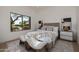 Cozy bedroom with large windows, neutral decor, stylish furnishings, and a comfortable queen-size bed at 7152 E Night Glow Cir, Scottsdale, AZ 85266