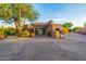 Elegant clubhouse entrance with desert landscaping, welcoming residents and guests to the community at 7152 E Night Glow Cir, Scottsdale, AZ 85266