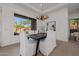 Bright dining area with modern light fixture and outdoor views at 7152 E Night Glow Cir, Scottsdale, AZ 85266