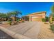 Inviting desert home with drought-resistant landscaping and a spacious driveway at 7152 E Night Glow Cir, Scottsdale, AZ 85266