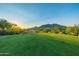 Lush green golf course with mountain views offering a serene and scenic outdoor recreational experience at 7152 E Night Glow Cir, Scottsdale, AZ 85266