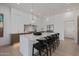 Modern kitchen features a large island with seating, stainless steel appliances and a stylish pendant light at 7152 E Night Glow Cir, Scottsdale, AZ 85266