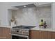 Close up of gourmet kitchen featuring stainless steel appliances, modern cabinetry, and marble countertops at 7152 E Night Glow Cir, Scottsdale, AZ 85266