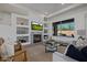 Inviting living room with fireplace, recessed lighting, and backyard views at 7152 E Night Glow Cir, Scottsdale, AZ 85266