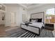 Main bedroom with natural light, a plush bed, contemporary decor and seamless access to the en-suite bathroom at 7152 E Night Glow Cir, Scottsdale, AZ 85266