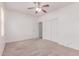 Spare bedroom featuring carpet and a closet with sliding doors at 7169 W Lamar Rd, Glendale, AZ 85303