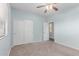 A cozy bedroom featuring carpet, closet, and a window for natural light at 7169 W Lamar Rd, Glendale, AZ 85303