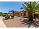 A well-manicured lawn and desert landscaping frame this charming home in a desirable neighborhood at 7169 W Lamar Rd, Glendale, AZ 85303