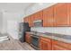 Kitchen with ample storage space and granite countertops, creating a functional cooking area at 7169 W Lamar Rd, Glendale, AZ 85303
