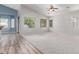 A light-filled living room featuring wood flooring and a seamless transition to an adjacent room at 7169 W Lamar Rd, Glendale, AZ 85303