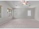 Spacious living room with neutral carpeting, providing a blank canvas for personalization and comfortable living at 7169 W Lamar Rd, Glendale, AZ 85303