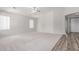 Bright and airy living room with neutral carpet, fresh white walls, and ample natural light at 7169 W Lamar Rd, Glendale, AZ 85303