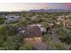 Beautiful home with a multi-car garage, manicured landscaping, a tile roof and stunning mountain views in the distance at 7640 E Poinsettia Dr, Scottsdale, AZ 85260