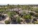 Aerial view of estate featuring a tile roof, mature landscaping, and lush foliage in the community at 7640 E Poinsettia Dr, Scottsdale, AZ 85260