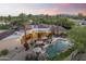 Aerial view showcasing a well-manicured pool, lounge area, and vibrant desert landscape at 7640 E Poinsettia Dr, Scottsdale, AZ 85260