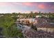 An aerial view showcases the luxurious pool, patio area, and desert landscaping at 7640 E Poinsettia Dr, Scottsdale, AZ 85260
