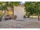 Backyard patio featuring decorative pots, gravel ground cover, stone accents, and seating offering a relaxing outdoor space at 7640 E Poinsettia Dr, Scottsdale, AZ 85260