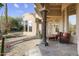 Inviting outdoor space with a covered patio and lush desert landscaping at 7640 E Poinsettia Dr, Scottsdale, AZ 85260